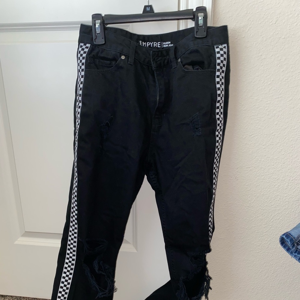 black mom jeans with rips on the knees